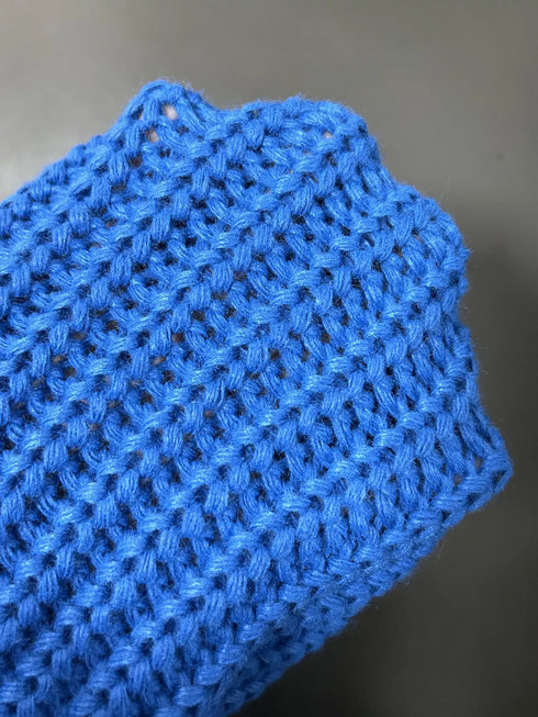 Close-up of thick Blue cardigan knit stitches
