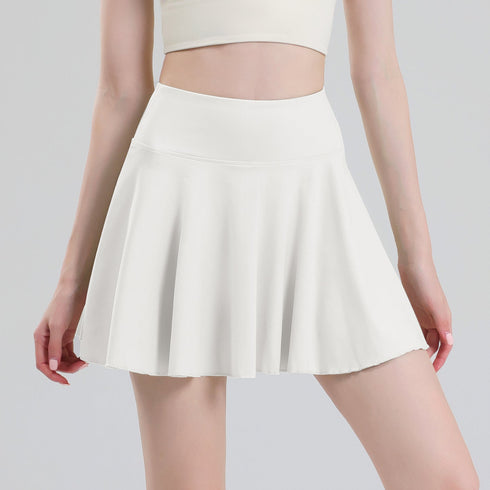 White pleated tennis skort front view on model