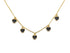 Gold-tone layering necklace with small black heart charms arranged on white