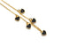 Close-up of the necklace black heart charms and gold-tone chain links