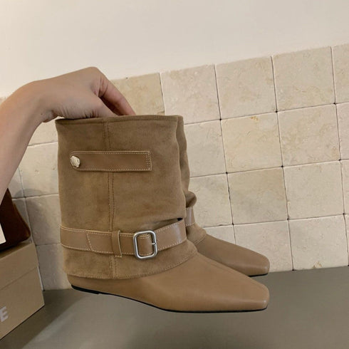 Khaki faux-leather boot showing buckle strap and pointed toe
