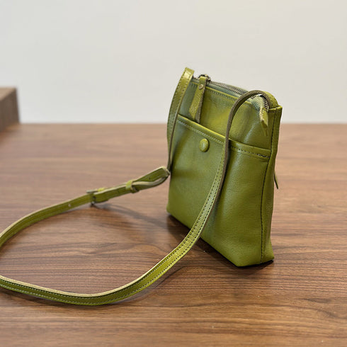 Side view of green RockCow T25017 bag showing its slim profile and adjustable strap