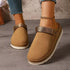 Brown round-toe clogs worn on a model, front view