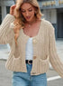 Cream cropped knit cardigan with large buttons and front pockets