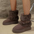 Brown round-toe platform boots worn on a model, showing plush cuffs and chunky soles
