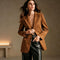 Camel suede-look blazer worn open with black trousers