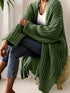Green chunky open-front cardigan, seated front view