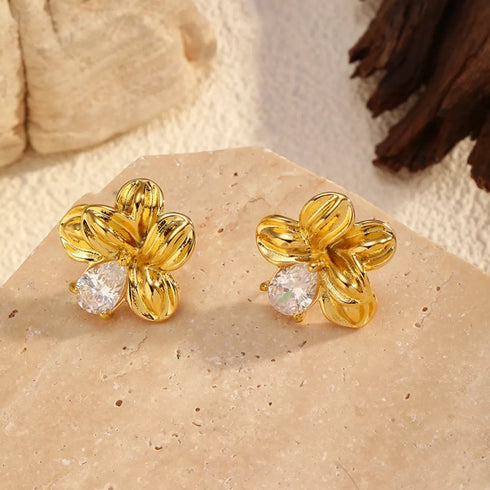Pair of gold-tone flower stud earrings with clear stone accents