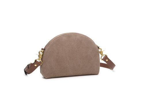Back of chocolate canvas Hopper crossbody showing curved shape