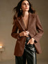Brown suede-look blazer showing long sleeves and tailored waist