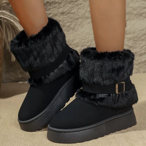 Black round-toe platform boots worn on a model with plush cuffs and buckle straps