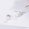 925 sterling silver heart stud earrings on a white card with butterfly backs visible