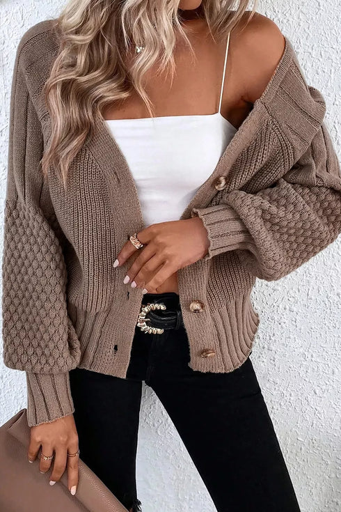 Taupe mixed-texture cardigan worn open with a white camisole