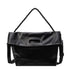Black foldover hobo bag with braided shoulder strap on white background