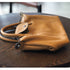Close-up of Brown RockCow TS923 leather handles, snap flap and zipper hardware
