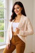 Cream Double Take textured open-front cardigan worn beside a window, front view