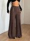 Brown plaid wide-leg pants worn with a black crop top