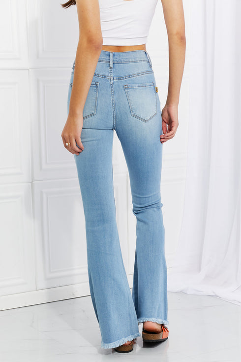 Jess light-wash flare jeans with back patch pockets, rear view