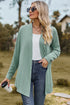 Front view of light green long cardigan with jeans