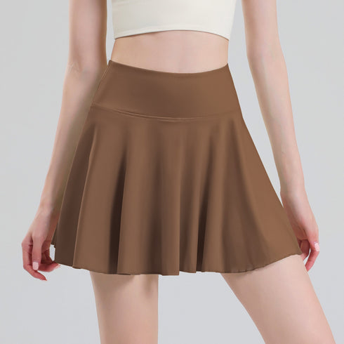 Coffee brown pleated tennis skort front view on model