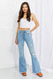 Light-blue Jess button-front flare jeans on model, full front view