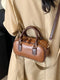 Vintage-inspired mini barrel crossbody bag — product image 1
