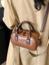 Vintage-inspired mini barrel crossbody bag — product image 1