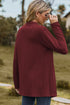 Back view of burgundy long cardigan with long sleeves