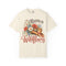 Raised on Wildflowers Comfort Colors tee in Ivory, front view with cowboy hat, colorful flowers and vintage-style lettering