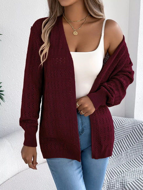 Burgundy crochet-knit cardigan, draped off one shoulder to show sleeve texture