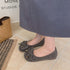 Grey textured flats showing the front bow detail