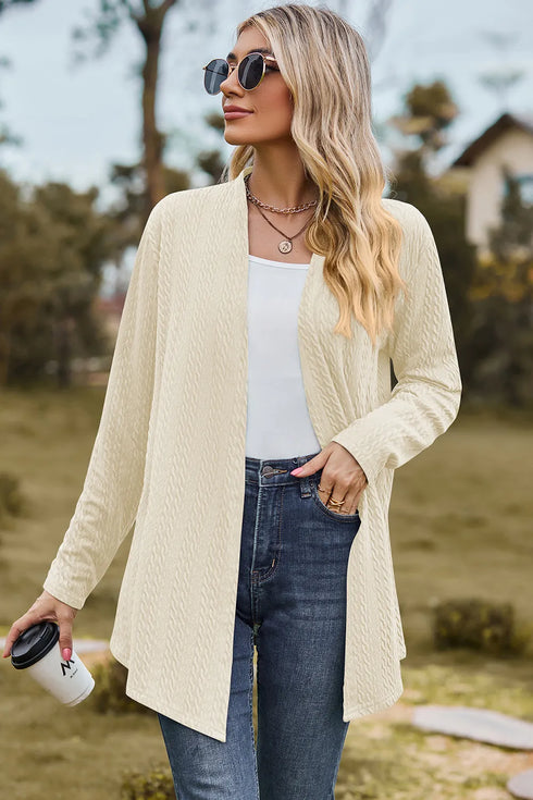 Cream open-front cardigan shown from the front with jeans