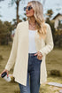 Cream open-front cardigan shown from the front with jeans