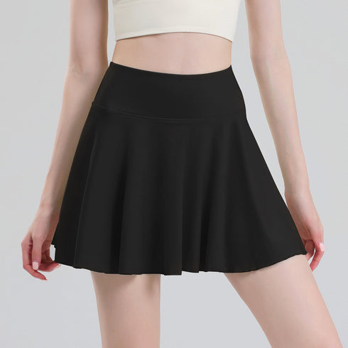 Black pleated tennis skort front view on model