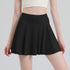 Black pleated tennis skort front view on model