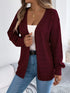 Burgundy crochet-knit cardigan, close front view showing ribbed cuffs