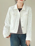 White pearl-style embellished denim jacket worn over a striped top