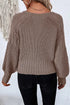 Back of taupe knit cardigan with ribbed hem and cuffs