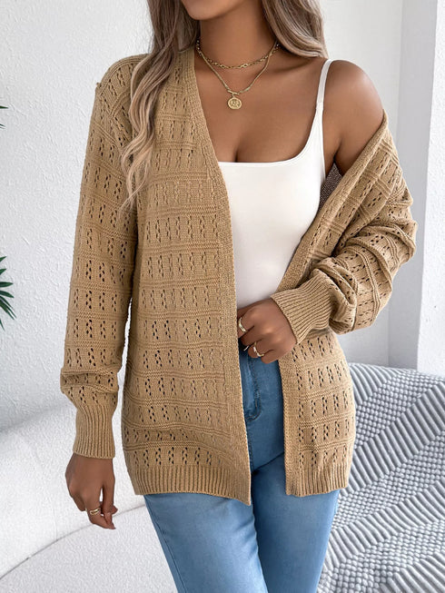 Khaki crochet-knit cardigan, draped off one shoulder to show sleeve texture