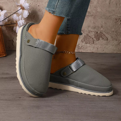 Side view of gray clogs with contrasting soles