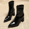 Black glossy pointed-toe ankle boots with chunky block heels