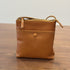 Brown RockCow T25017 leather bag showing its warm tan color and front pocket