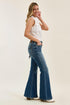 Side view of Judy Blue flare jeans worn with a white sleeveless top