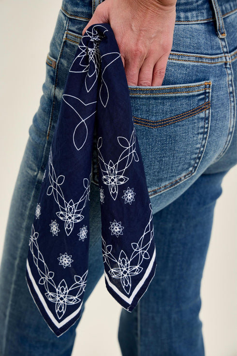Close-up of back pocket and navy printed bandana on Judy Blue jeans