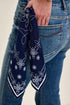 Close-up of back pocket and navy printed bandana on Judy Blue jeans