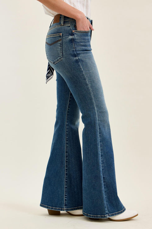 Angled view of Judy Blue flare jeans with front hand pocket