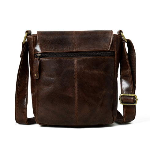 Rear view of brown leather crossbody bag with zipped pocket