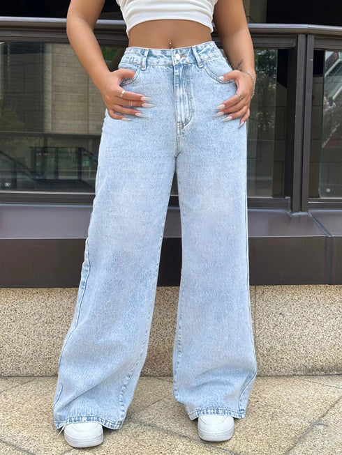 Front view of light blue jeans showing the waistband and wide legs
