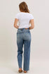 Back view of Judy Blue vintage-wash jeans on model