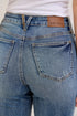 Close-up of Judy Blue waistband label and back patch pockets